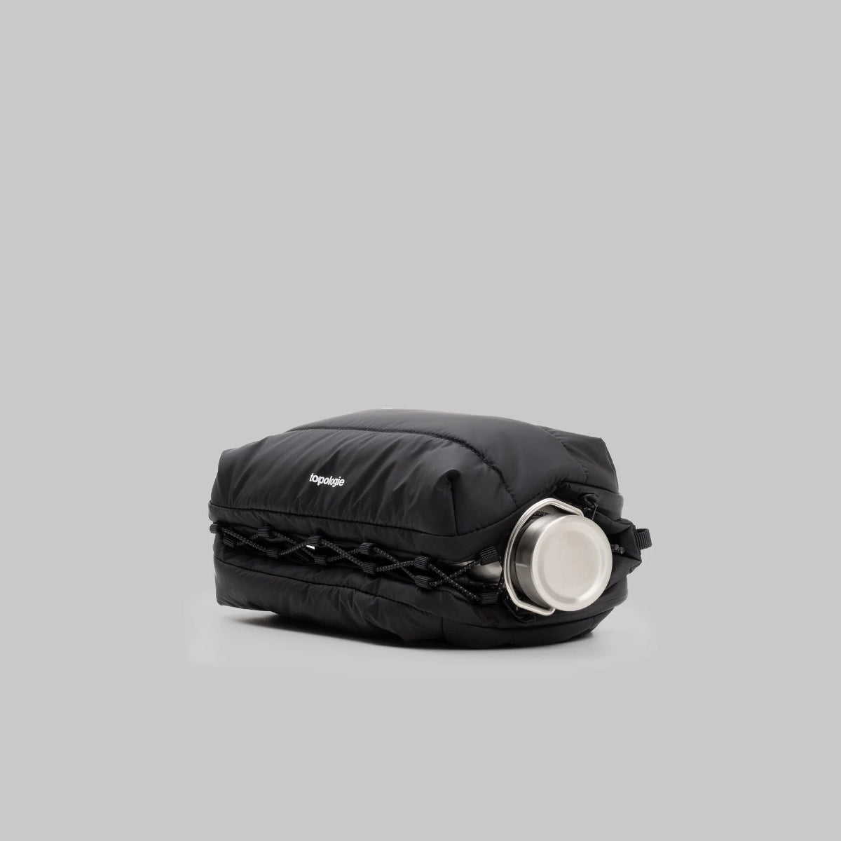 large puffy black bottle bag from Topologie on a grey background