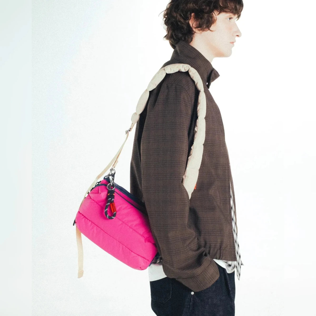 Large Topologie Puffy Bottle Sacoche in soft fabric with adjustable strap, designed for carrying bottles comfortably.