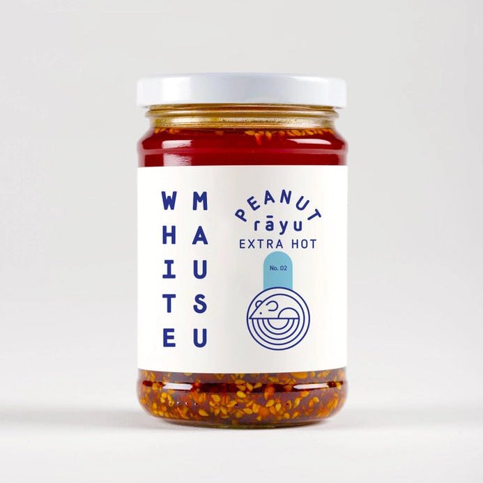 White Mausu Ltd Peanut Rayu Extra Hot Sauce in a glass bottle, showcasing vibrant chili oil and sesame seeds on the label.