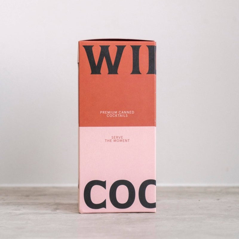 Set of three Williams Premium Canned Cocktails featuring colorful cans with fruit illustrations and beverage labels.
