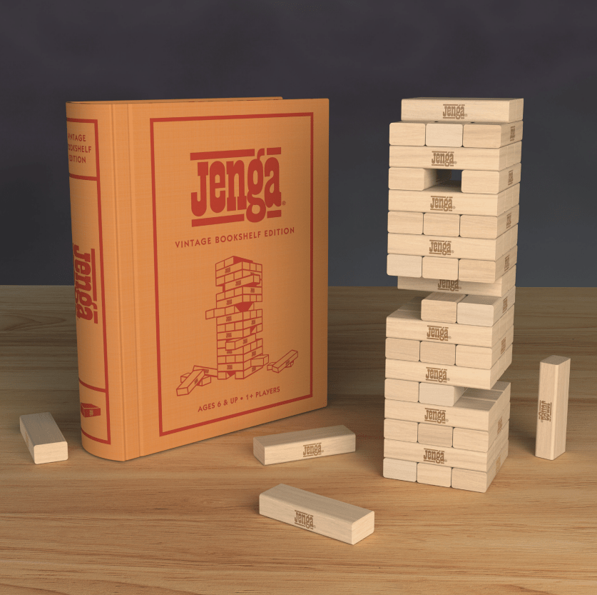 Stacked wooden Jenga game blocks from WS Game Company Vintage Bookshelf Edition on a table.