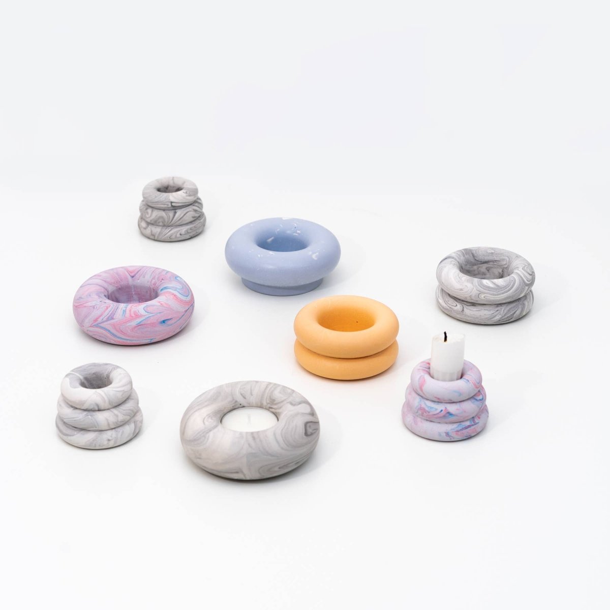 Grey marble Triple O candleholder by YOD&CO with three circular holders on a sleek marble base.