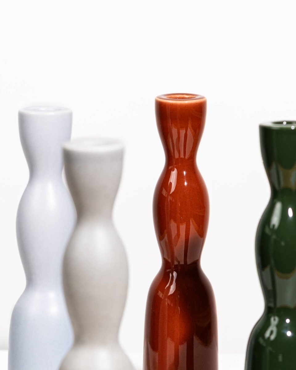 Tall dark green Wave Candleholder by YOD&CO, featuring a sleek, wavy design perfect for decorative candle display.
