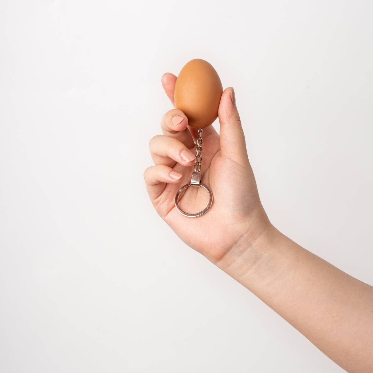 Colorful keychain egg accessory by Yumazing, made by Connectrade AG, featuring a playful and bright design for keys or bags.