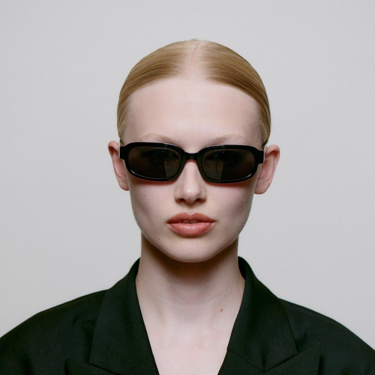 A. Kjaerbede Will sunglasses with stylish frames and tinted lenses, shown on a plain background.