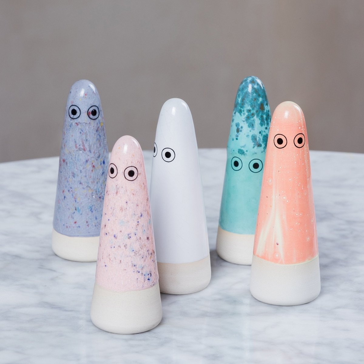 Studio Arhoj ceramic Ghost figure with smooth white finish and subtle facial features, handcrafted decorative art piece.