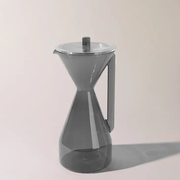 Yield pour over coffee carafe with a clear glass design and black handle for brewing and serving coffee.