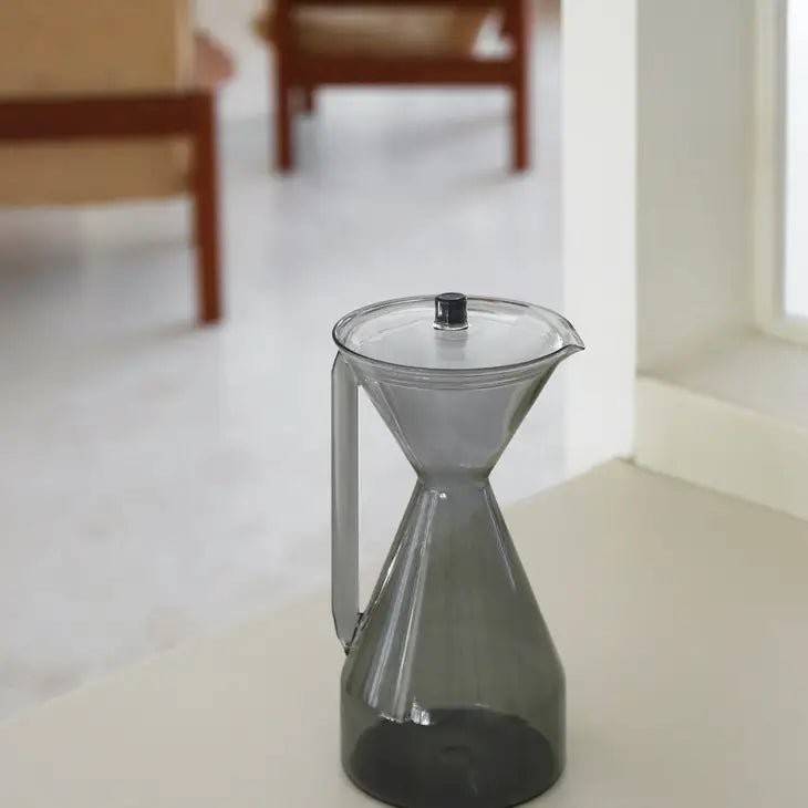 Yield coffee pour over carafe for brewing coffee, clear glass with a sleek design and a handle for easy pouring.