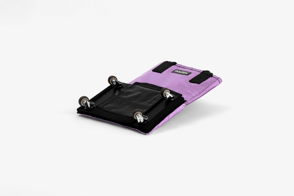 Small Hulken Bag in lilac color with a compact design, featuring a top handle and sleek style.