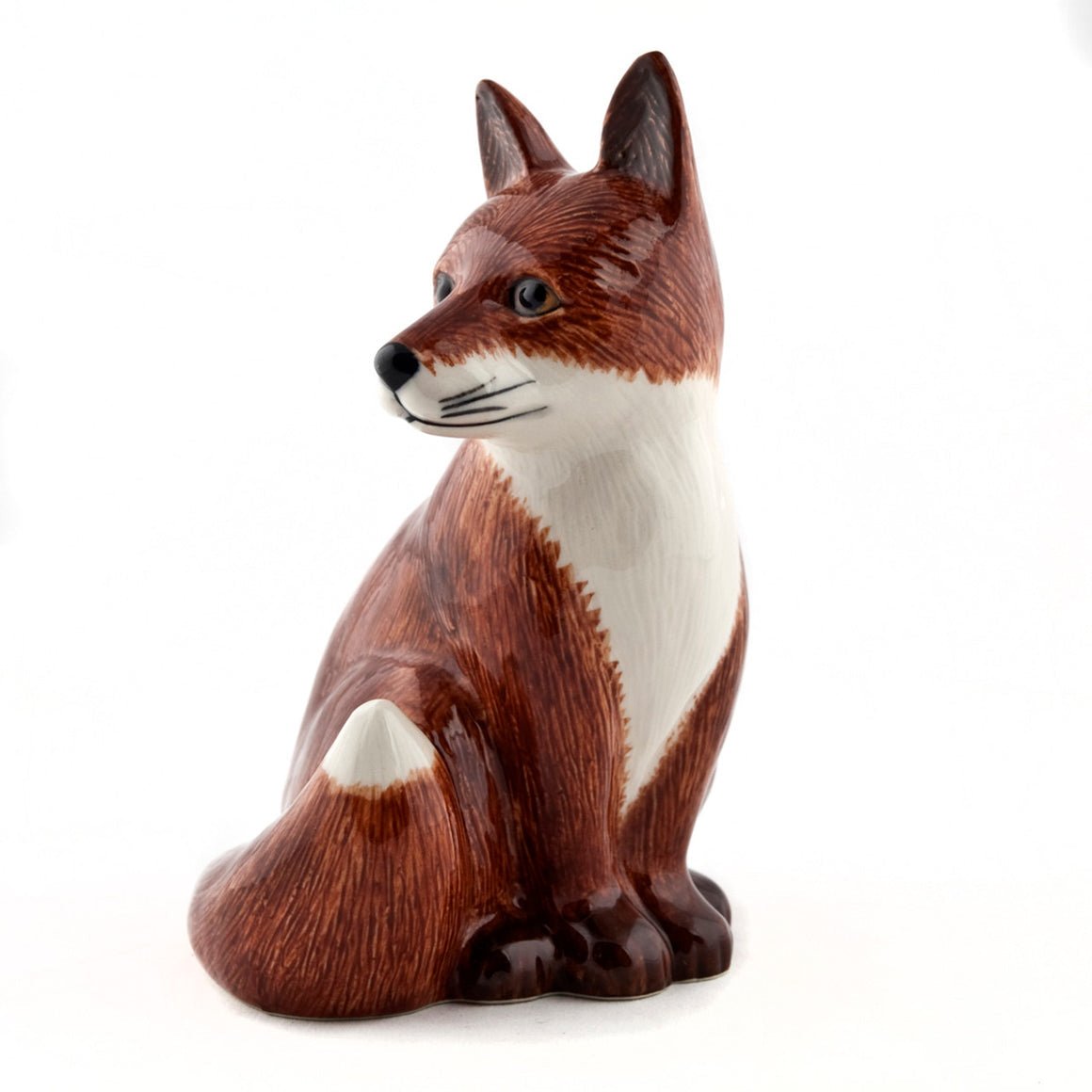 Quail Ceramics Fox money box featuring a charming fox design, made of ceramic with a coin slot on top.