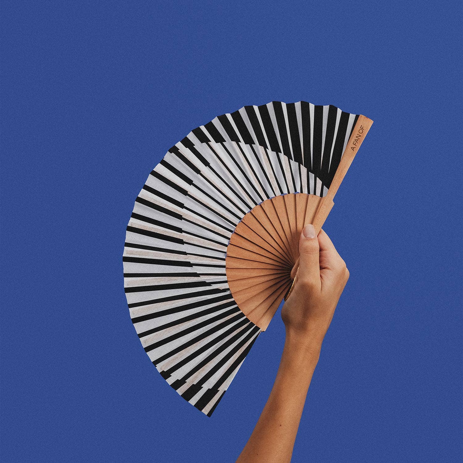 Black and white 19 cm Minimal Melody Fan by A Fan Of, showcasing sleek, modern design and compact size.