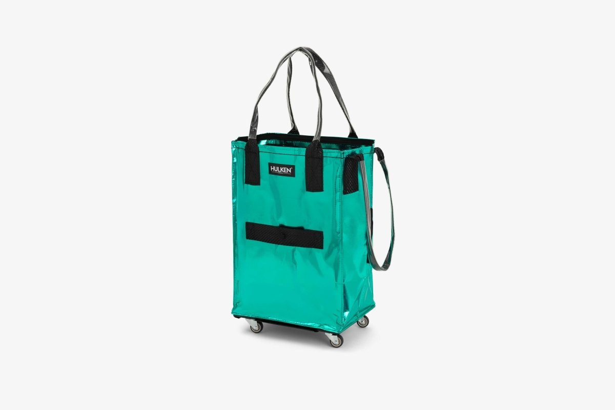 Small Hulken teal bag with adjustable strap and zipper closure, featuring a sleek, compact design ideal for everyday use.