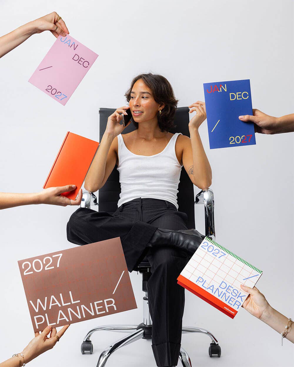 Dusty pink Mishmash 2027 Planner with time-block layout, featuring a sleek design and organized weekly planning pages.