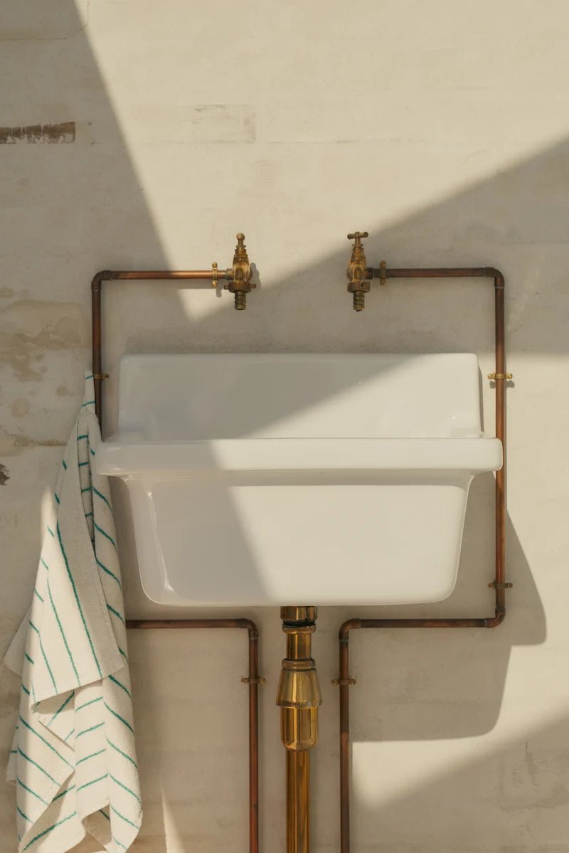 White and grass-colored Naram hand towel by Bongusta, soft bathroom towel with elegant textured design.