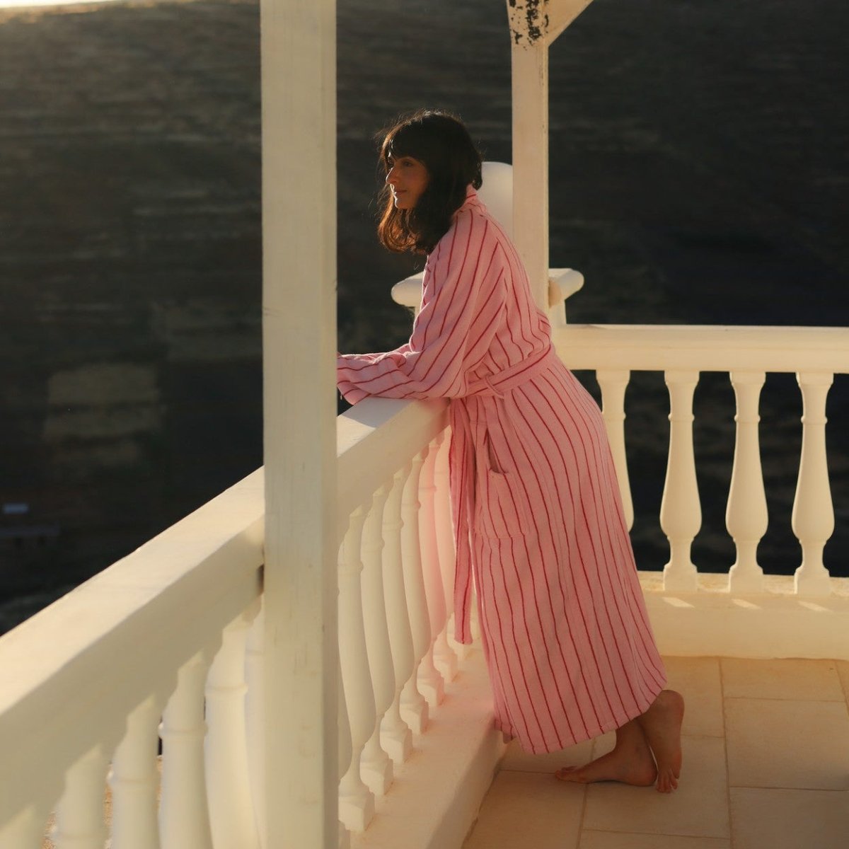 Baby pink and ski patrol red Naram bathrobe by Bongusta, soft bathroom loungewear with cozy, plush fabric.