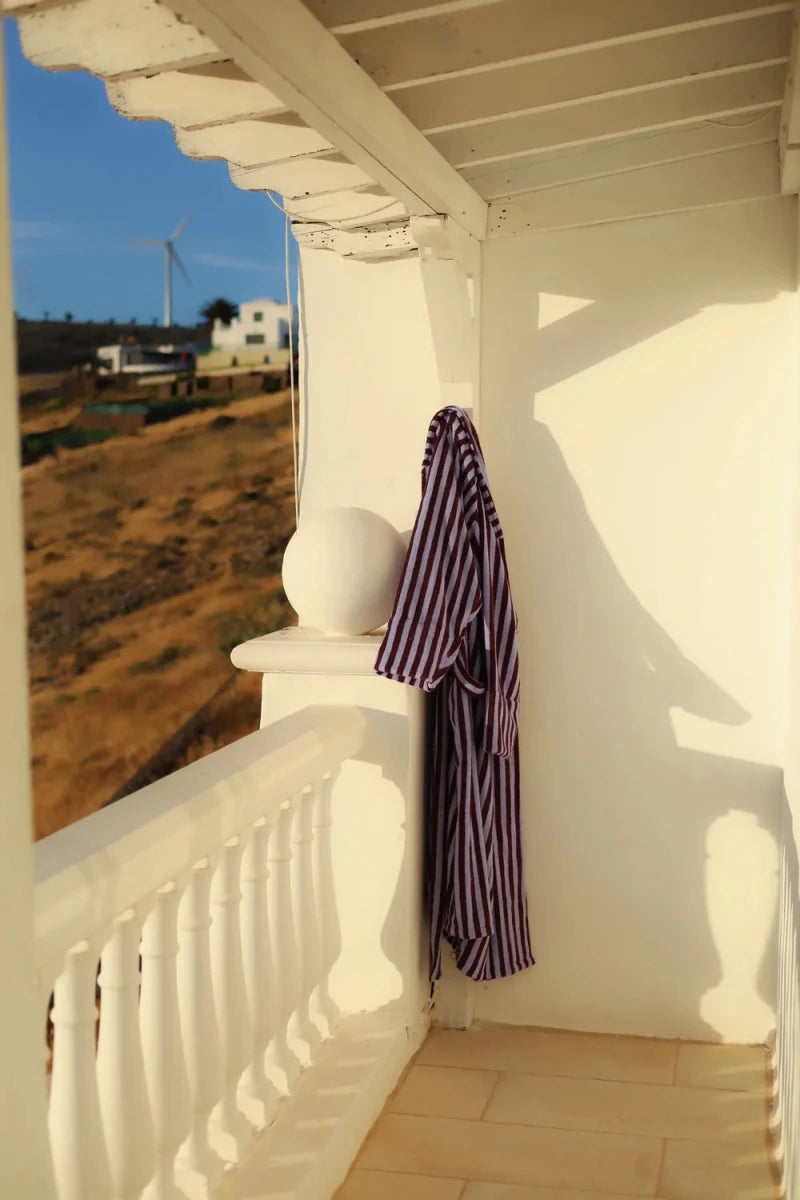 Bongusta Naram bathrobe in wine and lavender blue, soft bathroom robe with plush fabric and stylish design, displayed on a hanger.