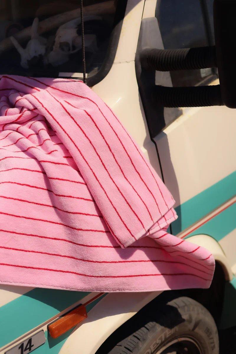 Soft pink baby pink and ski patrol bathroom towel by Bongusta, with a plush, absorbent texture and decorative design.