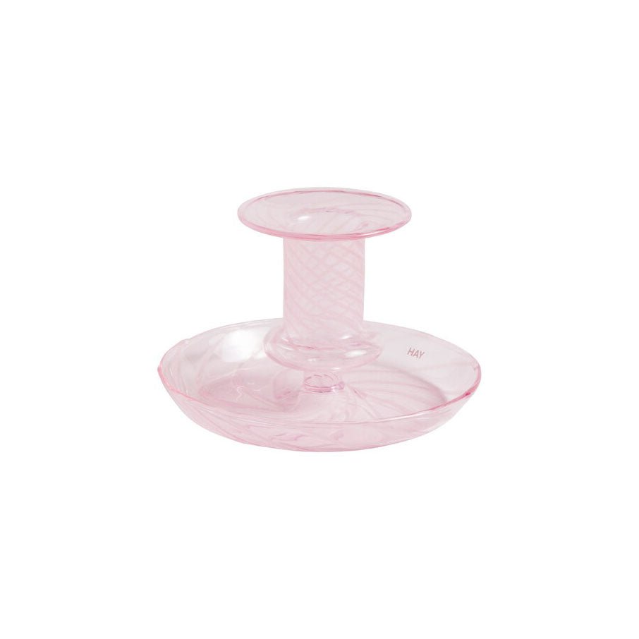 Pink flare candleholder with white stripe design by HAY, featuring a modern, curved shape and decorative pattern.