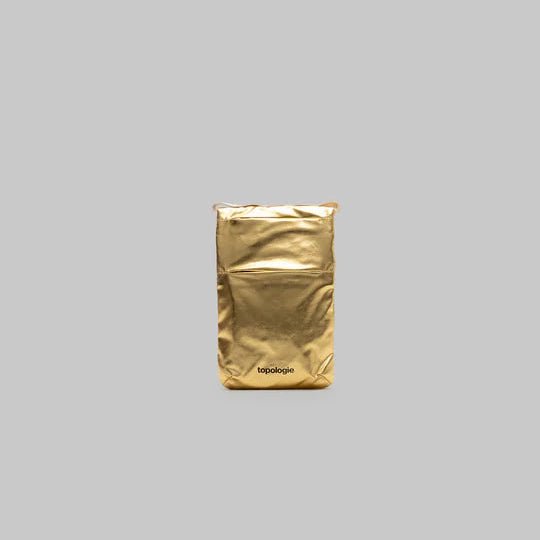 Gold pouch with a brand logo on a gray background