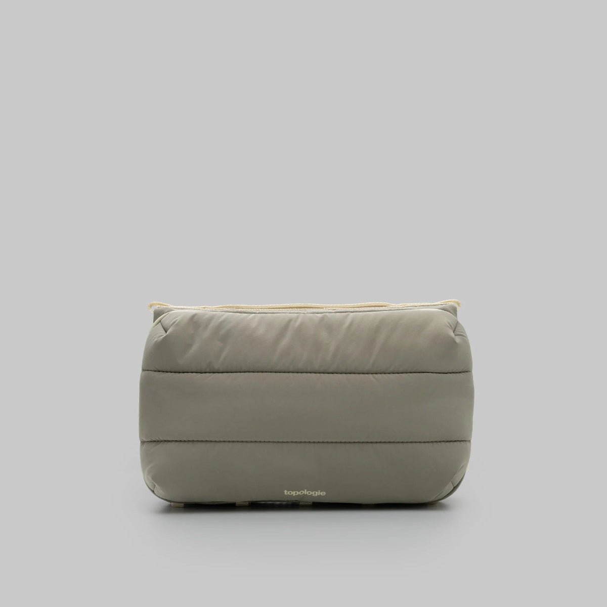 Large Moss putty puffy bottle bag from topologie on a grey background