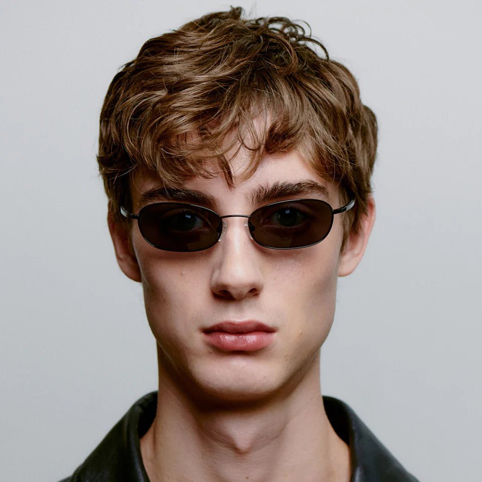 A. Kjaerbede Jack sunglasses with black frames and dark tinted lenses, stylish and trendy eyewear for sunny days.