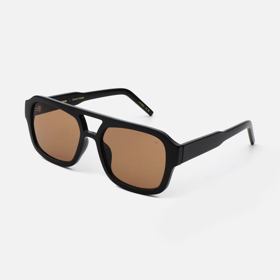 A. Kjaerbede Kaya sunglasses with round frames and tinted lenses, stylish eyewear for sun protection.