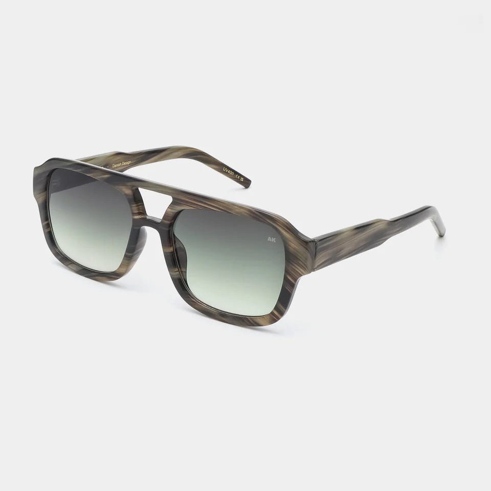 A. Kjaerbede Kaya sunglasses with round frames and tinted lenses, stylishly displayed against a neutral background.