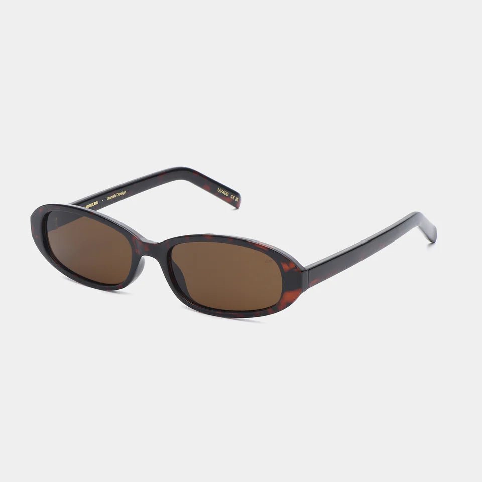 A. Kjaerbede Macy sunglasses with stylish frames, featuring dark tinted lenses and a modern design for casual wear.