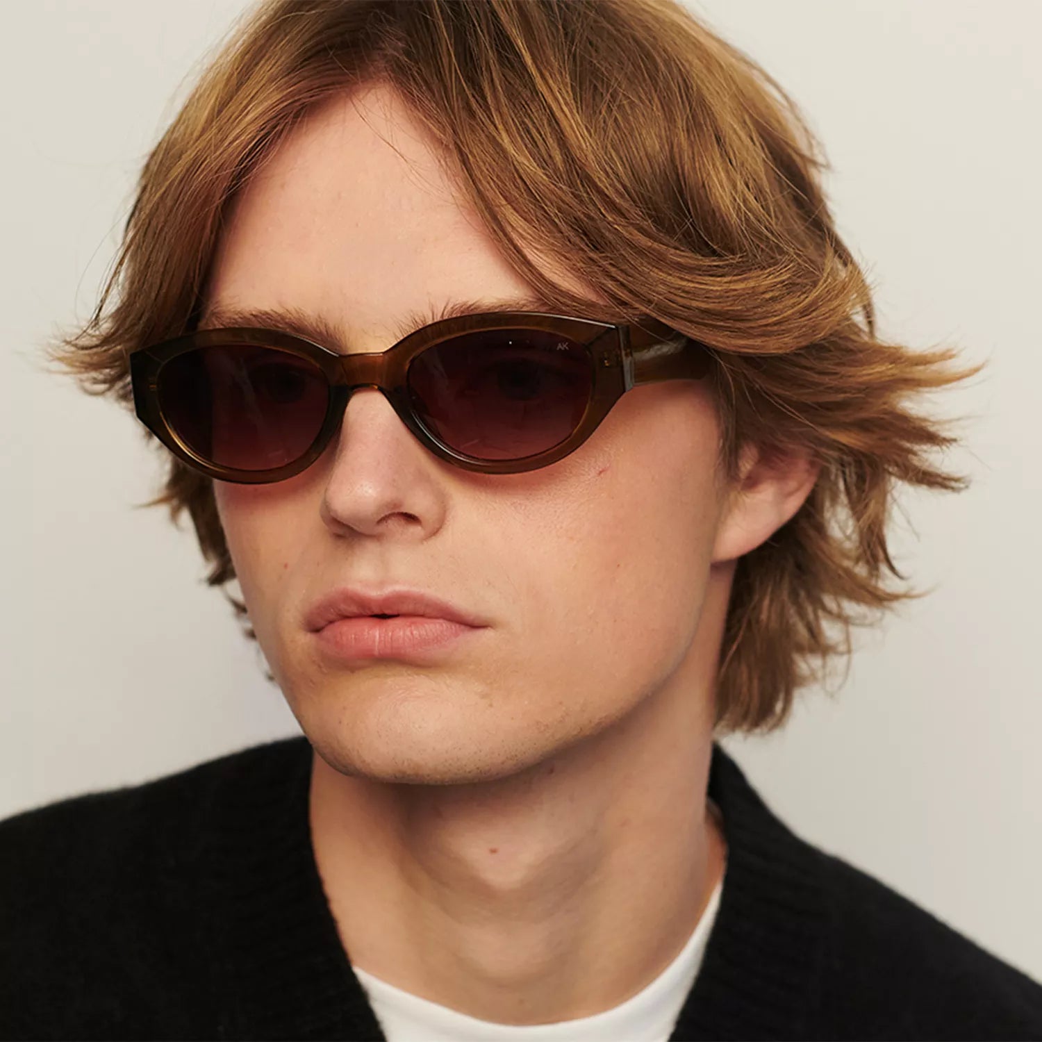 A. Kjaerbede Winnie sunglasses with black frame and tinted lenses, stylish and functional eyewear for sun protection.