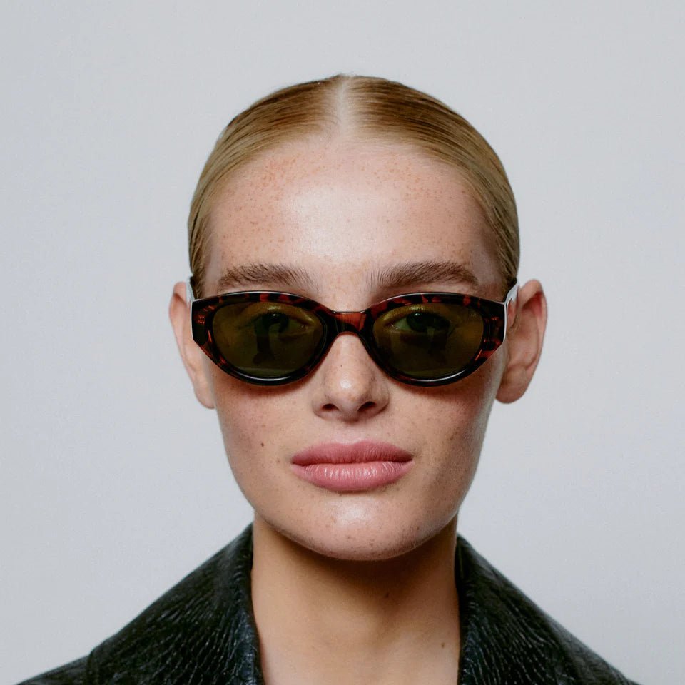 A. Kjaerbede Winnie sunglasses with round frames and tinted lenses, stylish and trendy for sun protection.