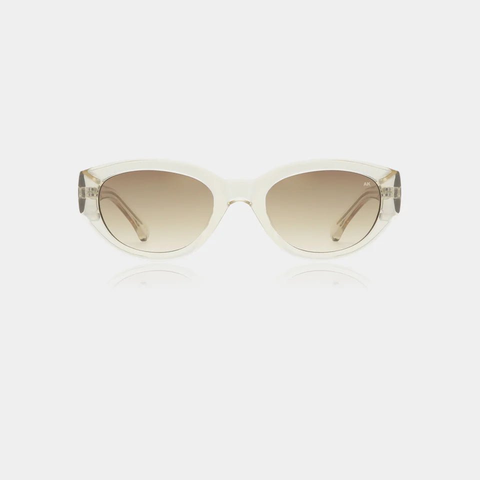 A pair of A. Kjaerbede Winnie sunglasses with round frames and dark tinted lenses on a white background.