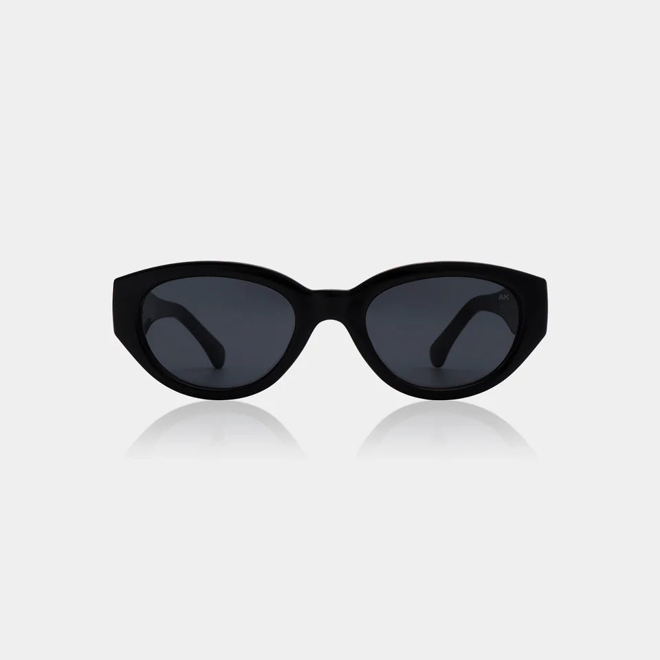 A. Kjaerbede Winnie sunglasses with stylish frames and tinted lenses, shown on a white background.