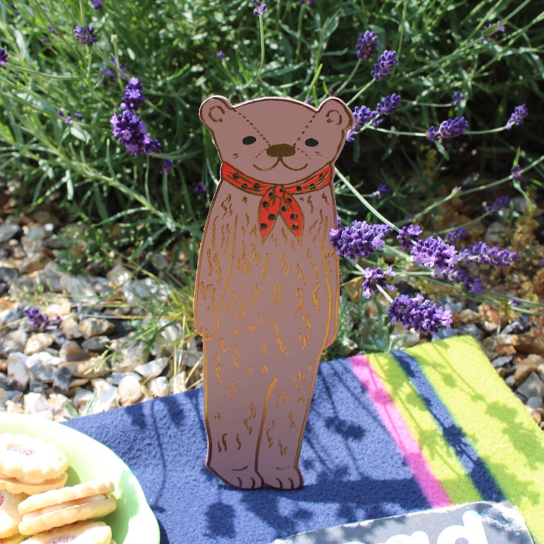 Gold bear-shaped bookmark by Ark Colour Design, featuring a detailed, cute bear figure for marking pages in books.