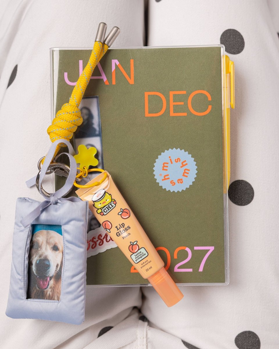 Olive green 2027 mishmash planner with time-block layout, featuring a sleek cover and organized pages for scheduling.