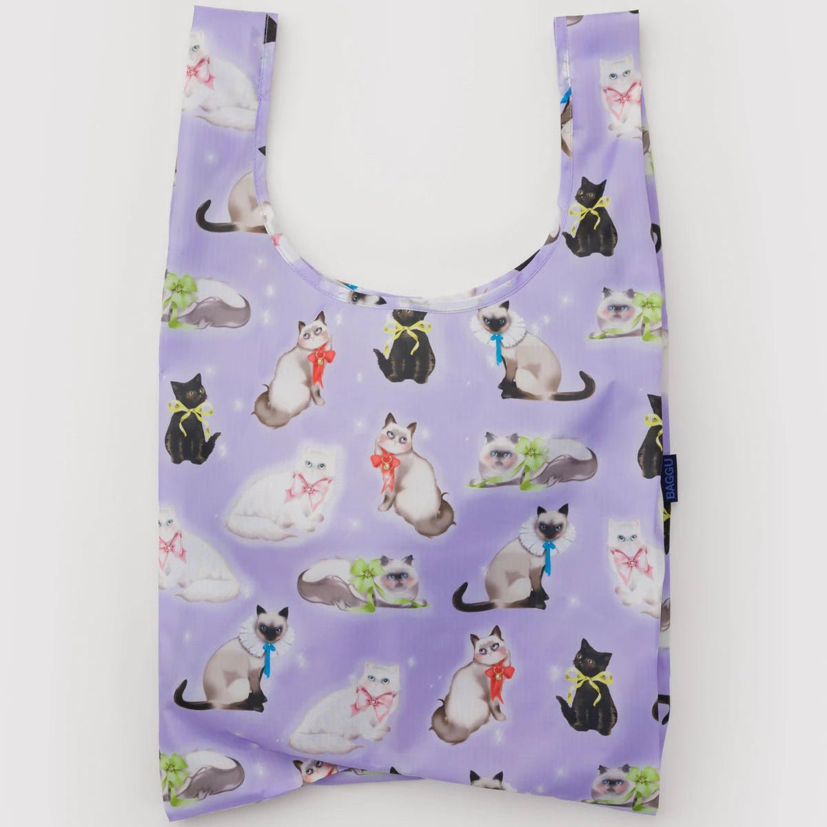 Purple reusable bag with fancy cat pattern on a white background