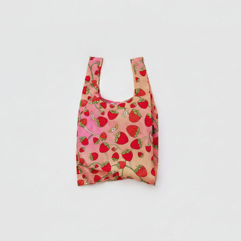 Reusable bag with strawberry pattern on a light gray background