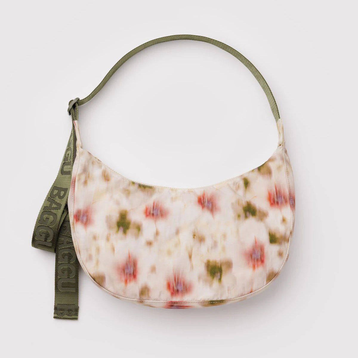 Baggu Crescent Shoulder Bag in soft fabric with adjustable strap, featuring a sleek, minimalist design and spacious interior.