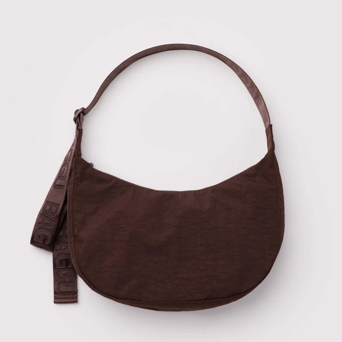 Baggu Crescent Shoulder Bag in soft fabric with adjustable shoulder strap, designed for casual everyday use.