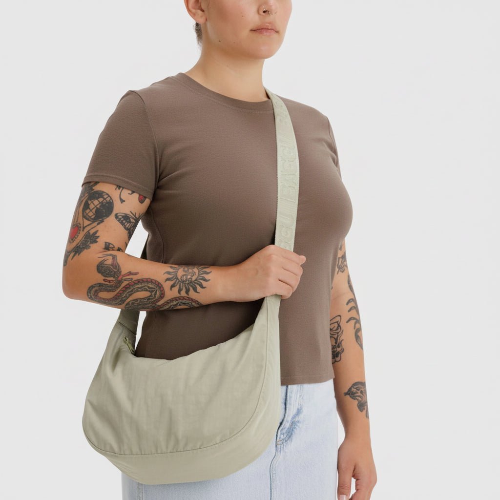 Baggu Crescent Shoulder Bag with adjustable strap and sleek design, made of durable material in a stylish shape.