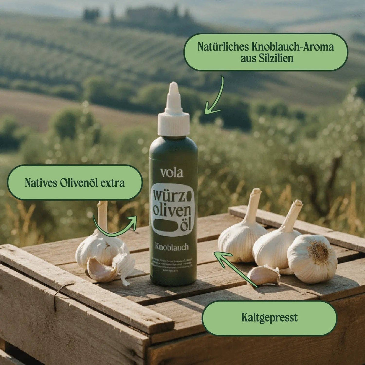 Vola garlic-infused olive oil in a clear bottle with garlic cloves, showcasing the rich, golden color of the garlic-flavored olive oil.