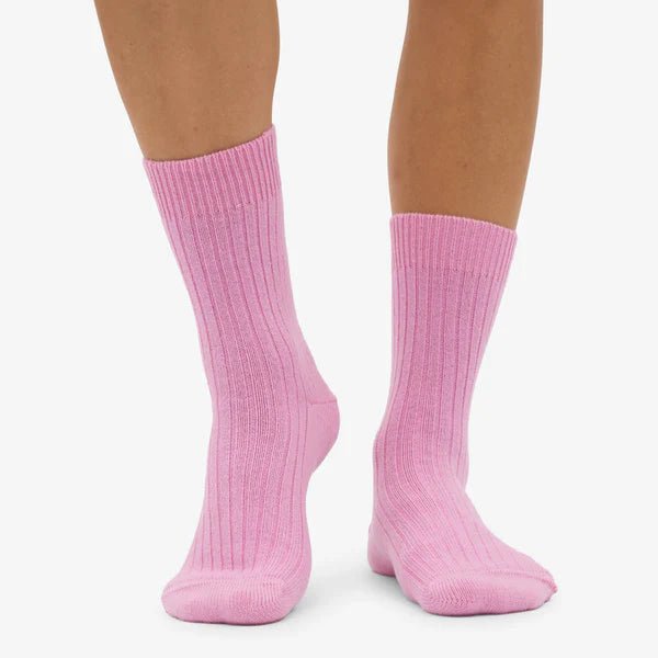 Colorful Standard merino wool blend socks in vibrant rainbow stripes, showcasing soft, cozy knit fabric and colorful design.