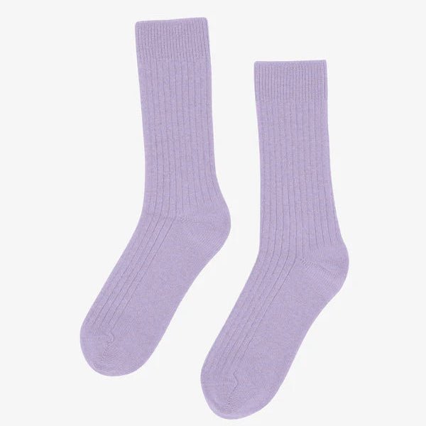 Colorful Standard Merino Wool Blend Socks featuring vibrant, multicolored patterns and comfortable knit texture.