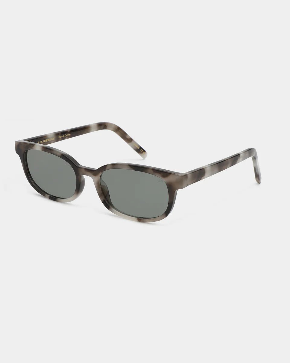 A. Kjaerbede Charlie sunglasses with cookie dough-colored frames and tinted lenses, stylish eyewear for sunny days.