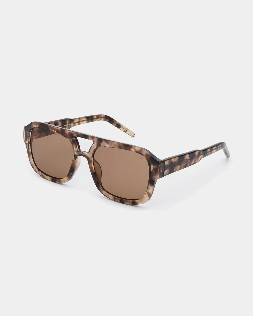 A pair of Kaya sunglasses by A. Kjaerbede with round frames and tinted lenses, displayed against a neutral background.