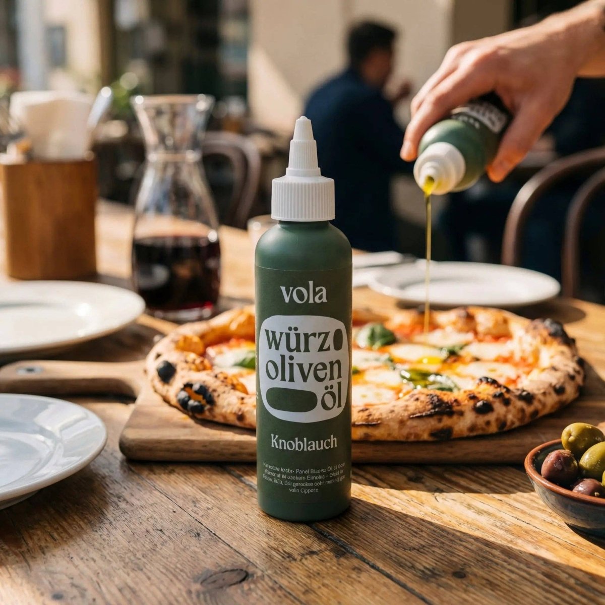 Vola garlic oil bottle with intense olive oil and garlic, featuring a clear label and dark glass container for culinary use.