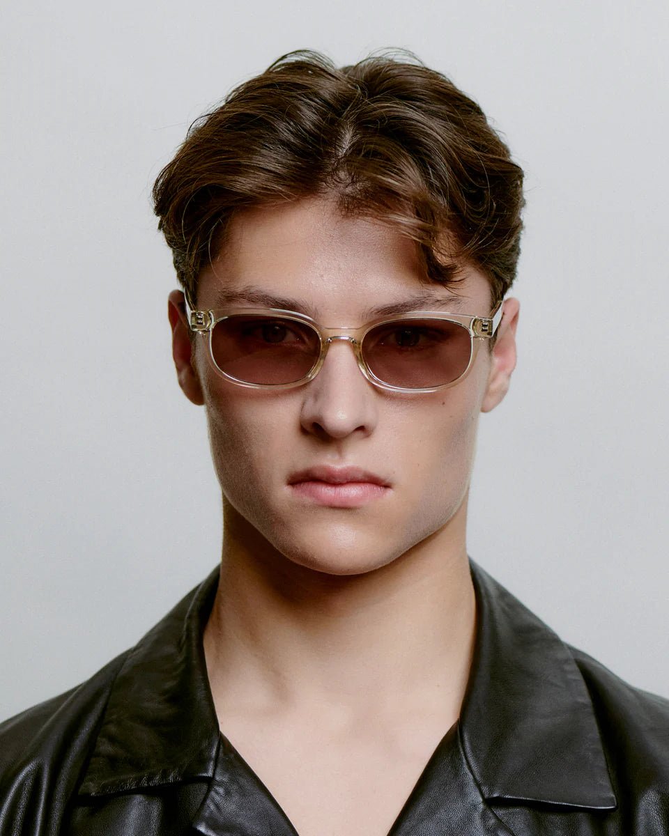 Ecru transparent Charlie sunglasses by A. Kjaerbede with round frames and clear lenses, stylish and lightweight for everyday wear.