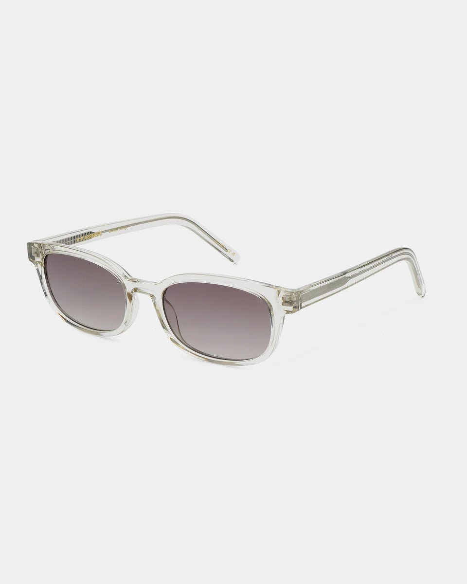 Ecru-transparent Charlie sunglasses by A. Kjaerbede with rounded frames and dark tinted lenses, stylish and lightweight eyewear.