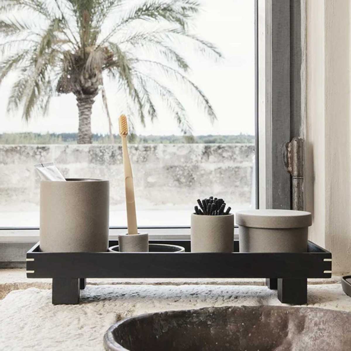 Small Ferm Living Bon Wooden Tray with curved edges and natural wood finish, ideal for serving or decorative use.