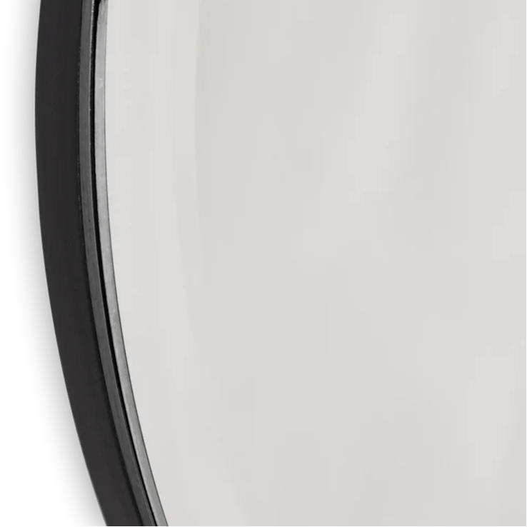 Full-size dark chrome Pond mirror by Ferm Living, showcasing a sleek modern mirror with a reflective surface and stylish frame.