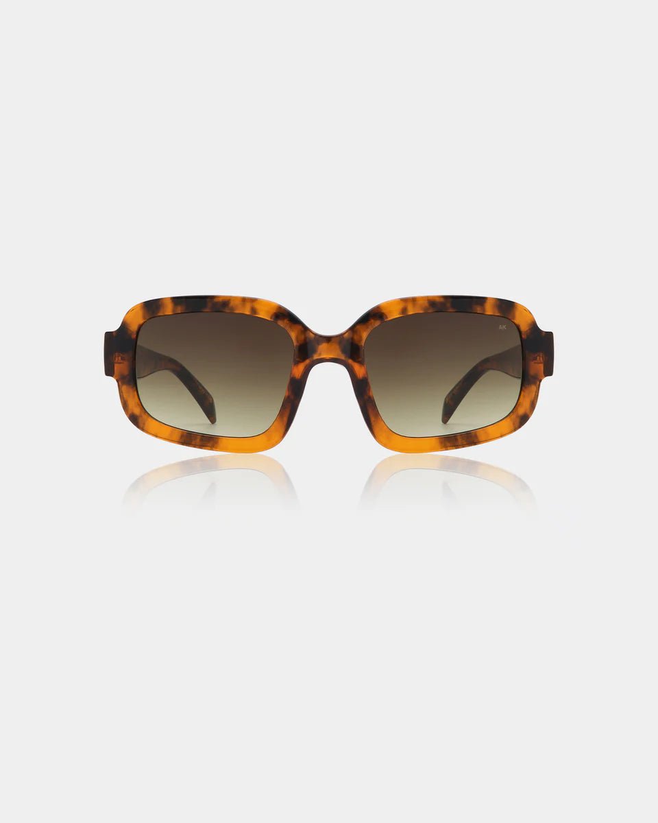 Havana-colored Pluto sunglasses by A. Kjaerbede featuring rounded frames and dark lenses.